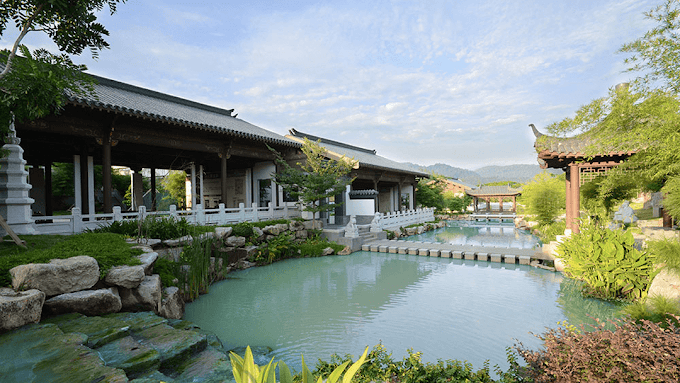 Pond and traditional waterside architecture at Nirvana Melaka