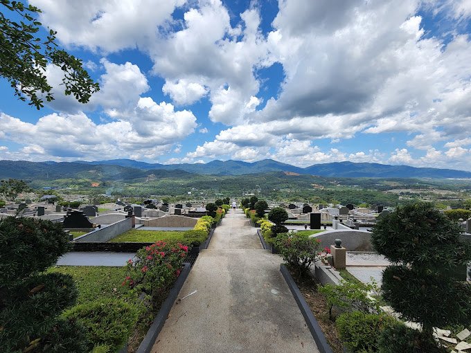 Hillside memorial landscape and distant mountain view at Nirvana Semenyih