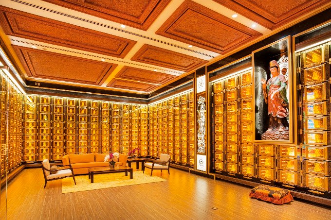 Warmly lit columbarium interior at Nirvana Shah Alam