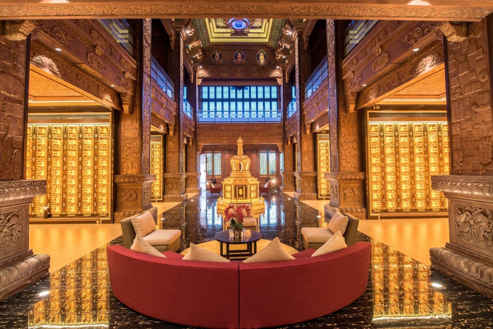 Palatial Nirvana columbarium hall with illuminated niches and an ornate central interior