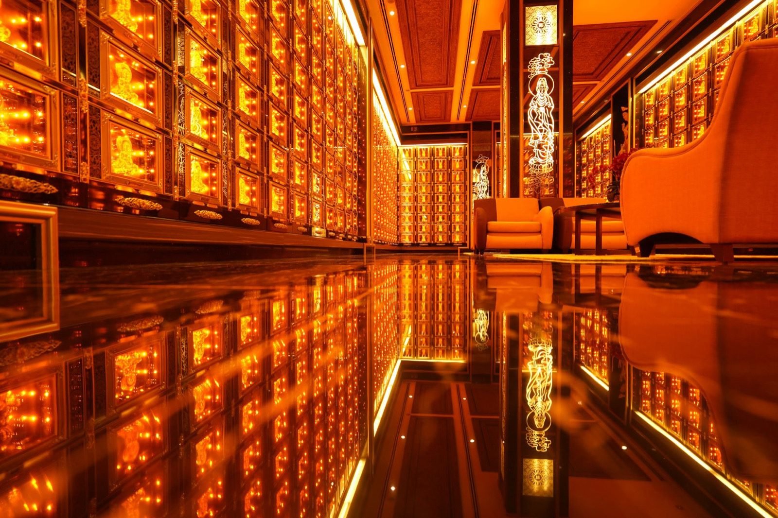 Luxuriously appointed columbarium hall with illuminated Buddhist memorial niches
