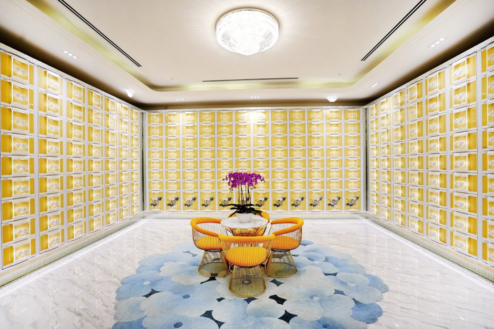 Bright modern columbarium with contemporary niche panels and a visitor seating area