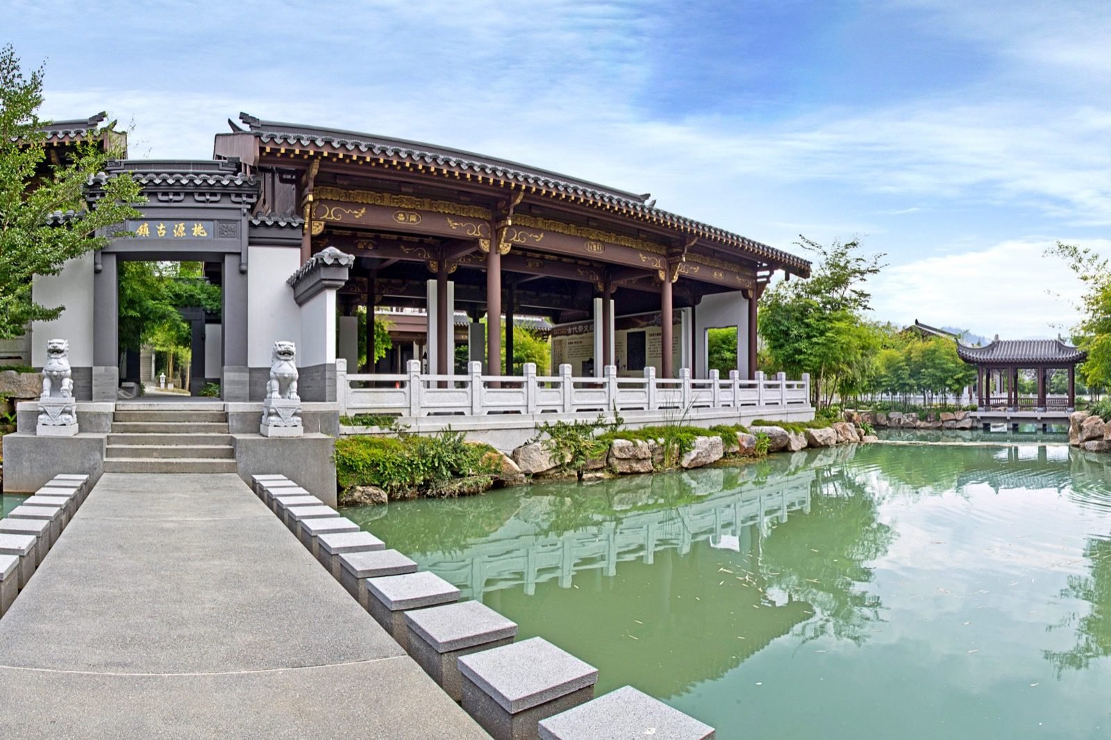 Traditional Chinese-style Oriental Villa columbarium beside a landscaped pond