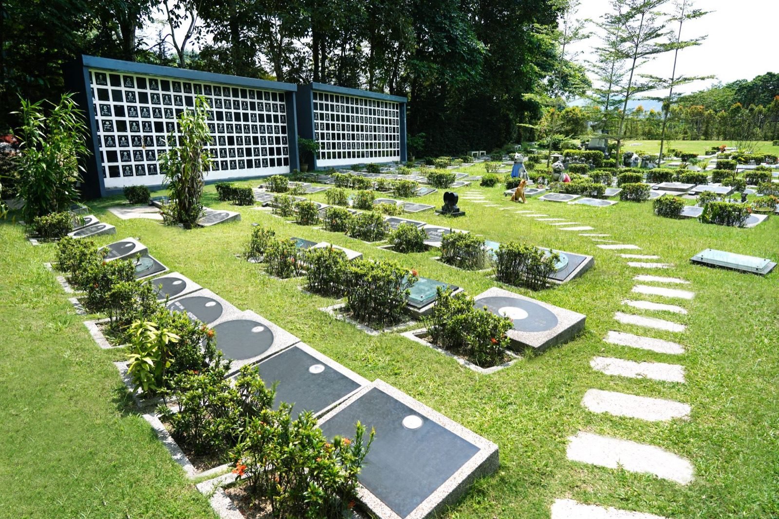 Landscaped pet burial plots and columbarium walls within Nirvana Pet Memorial Garden